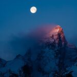 Photo by  | A brilliant full moon sets behind Grand Teton just as the morning al...